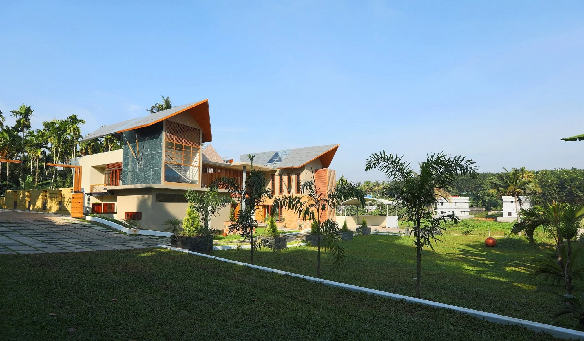 The villa across its landscaped lawn